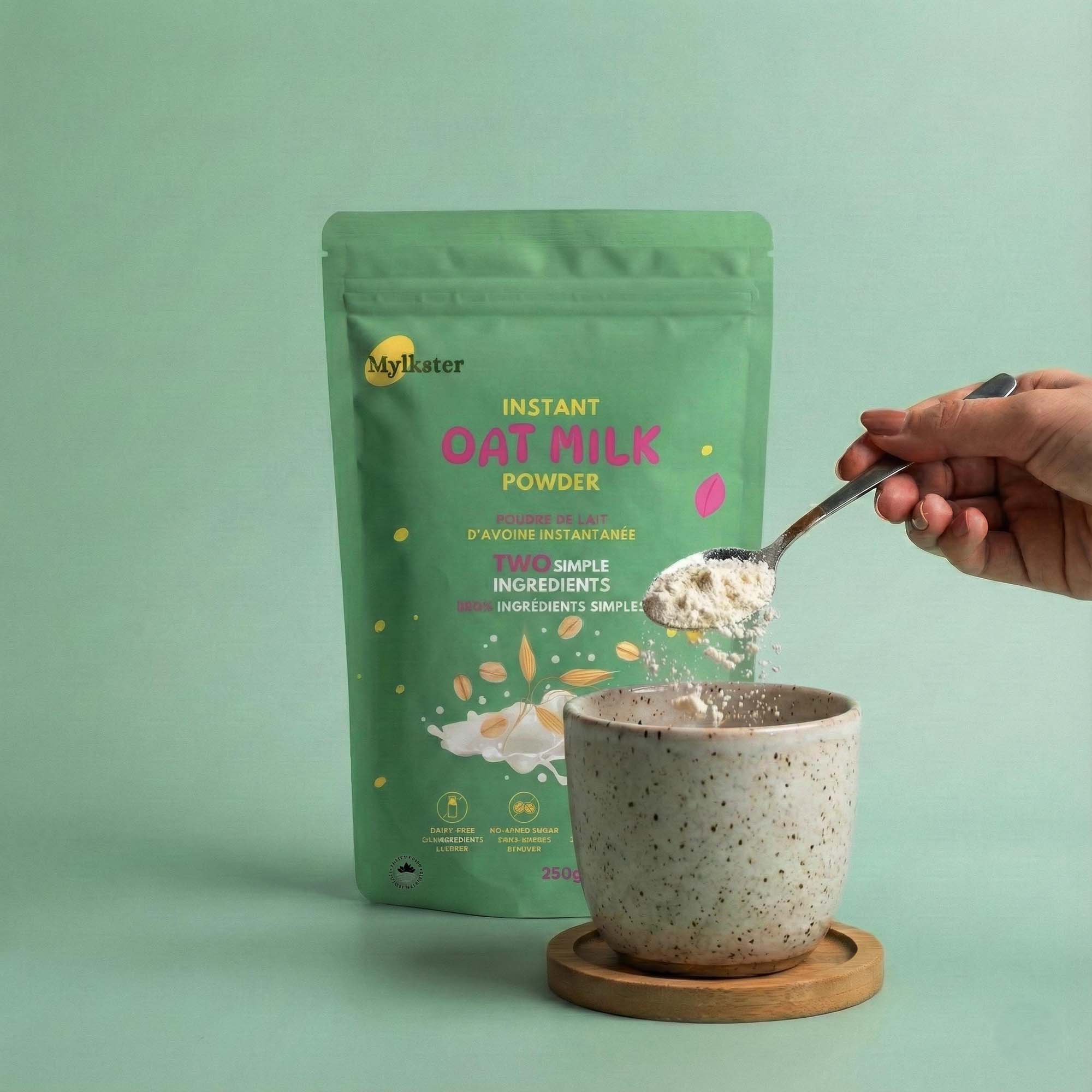 Green package of MyOat Instant Oat Milk Powder with a hand scooping powder into a bowl.